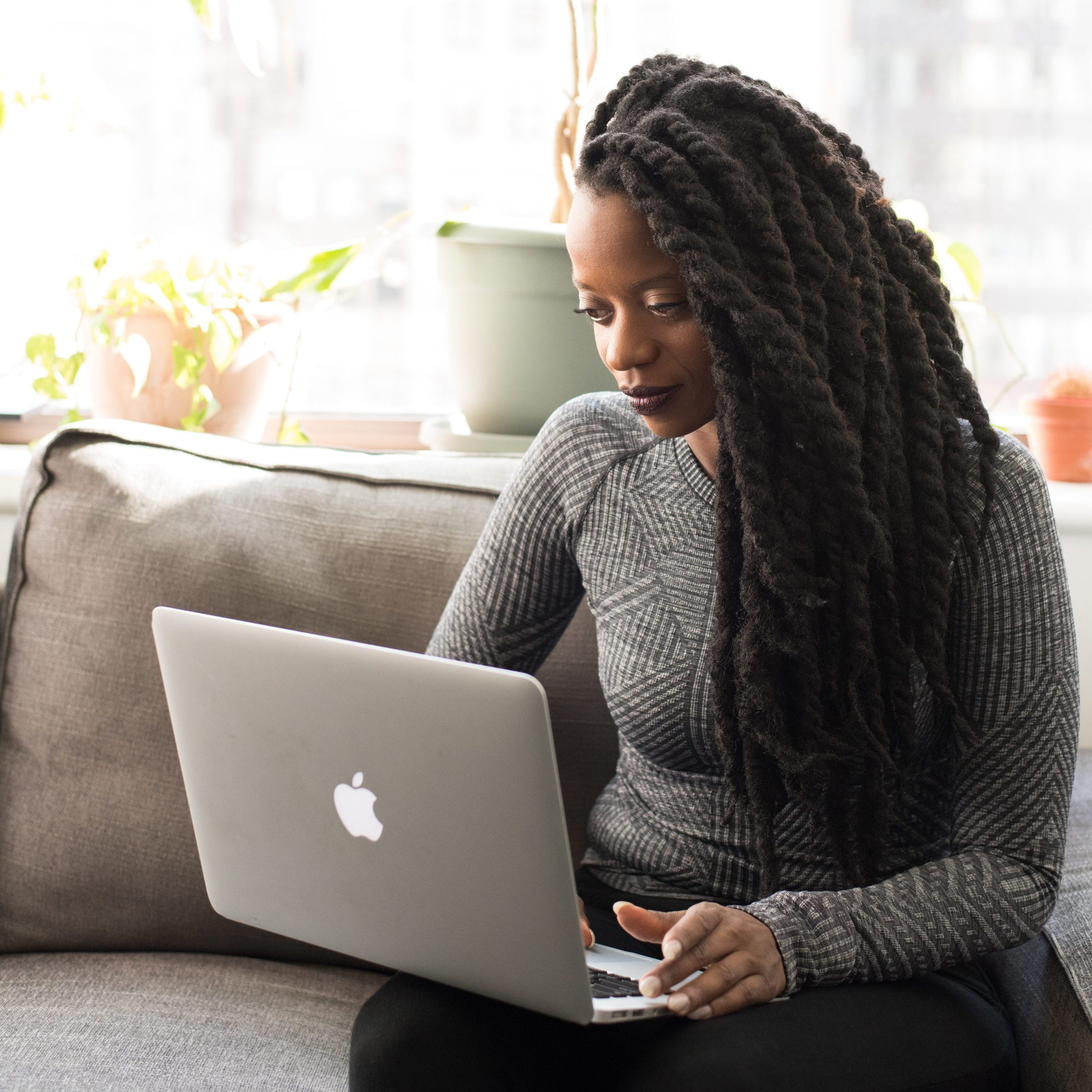 Woman on laptop for Backlinks Blog